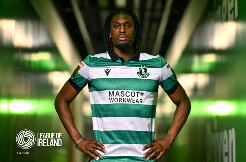 Shamrock Rovers player in green and white striped jersey in tunnel.